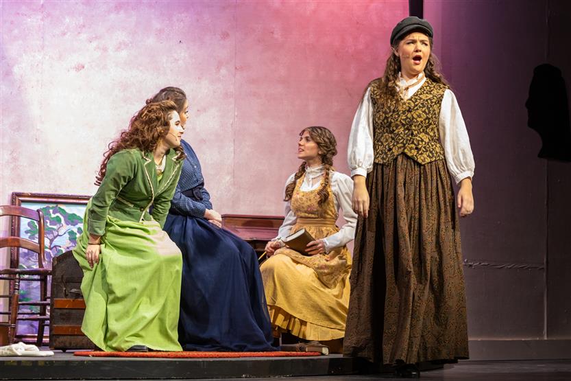 A group of students act onstage
